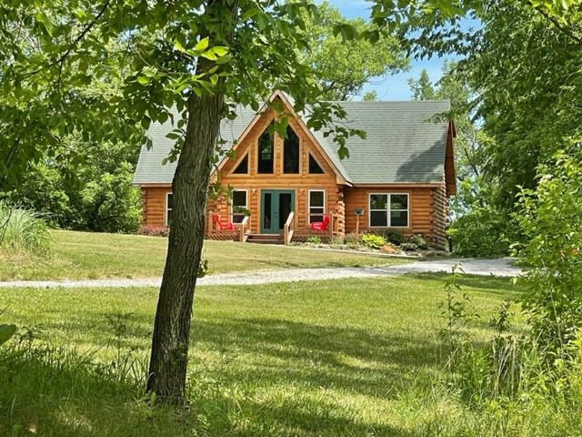 Main exterior view of the private vacation rental cabin at Circle O Lodge, showcasing the scenic rural property and peaceful lodging accommodations in Marceline, Missouri.