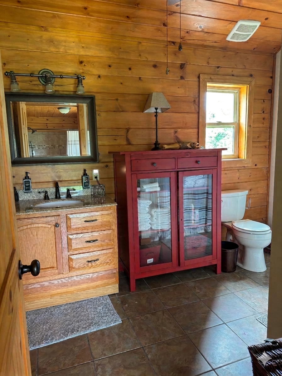 Spacious and fully stocked guest bathroom inside the cozy rental cabin at Circle O Lodge in Marceline Missouri.