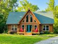 Front View of Log Cabin and Driveway Approach